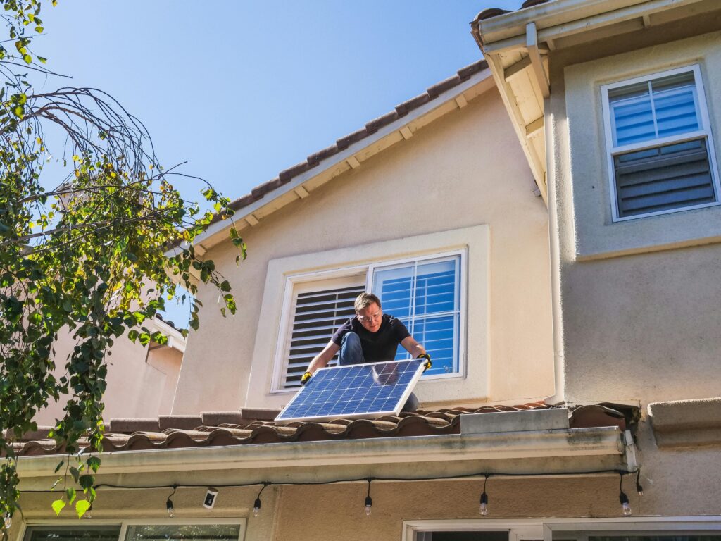 Arizona solar rebates 2026 home with rooftop solar panels during sunset representing tax credits, solar savings, energy independence, and clean energy incentives for homeowners